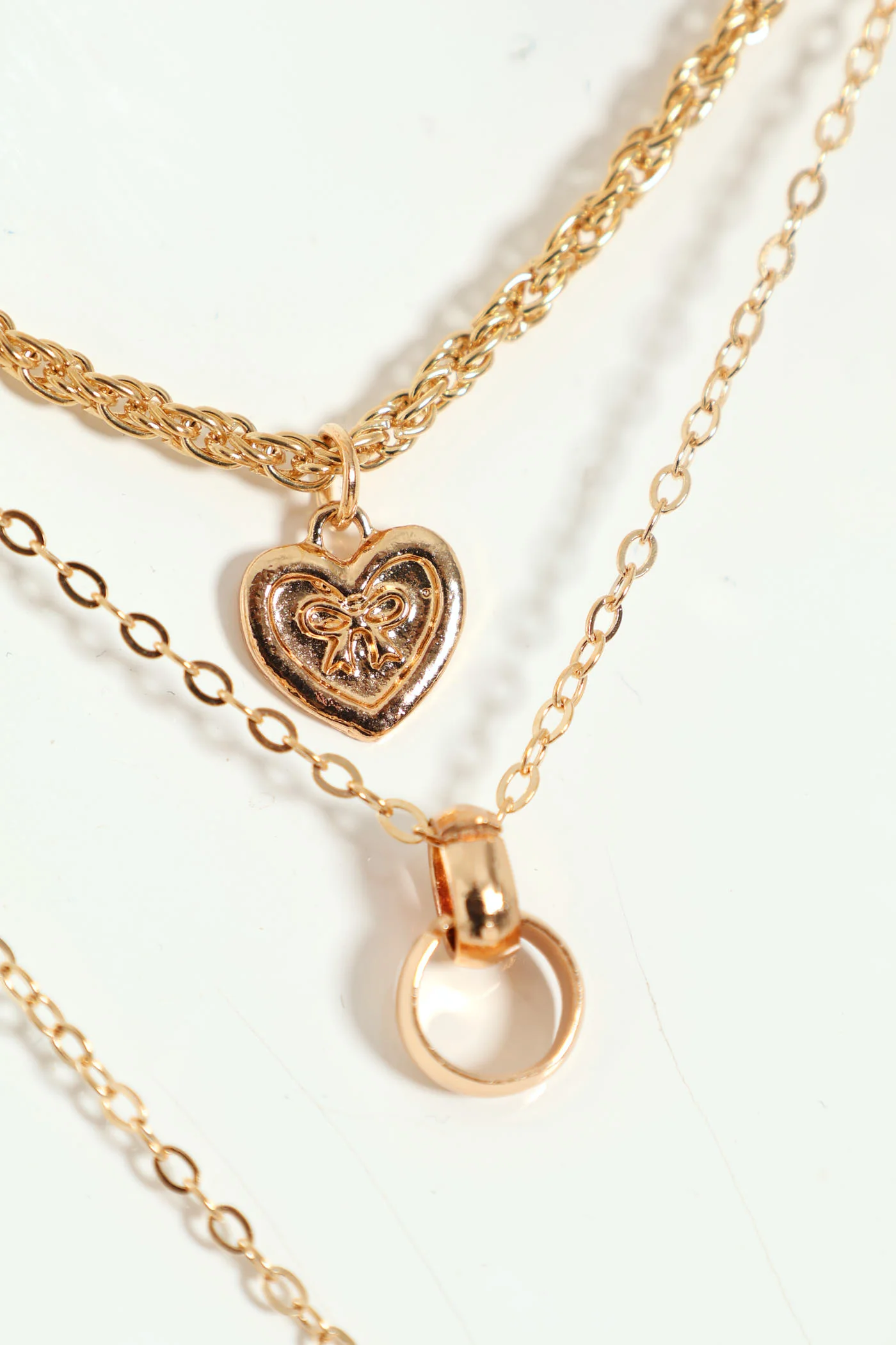 4 Layer Diamante Bow Heart And Disc Pendant Necklace - Gold - Image 2
