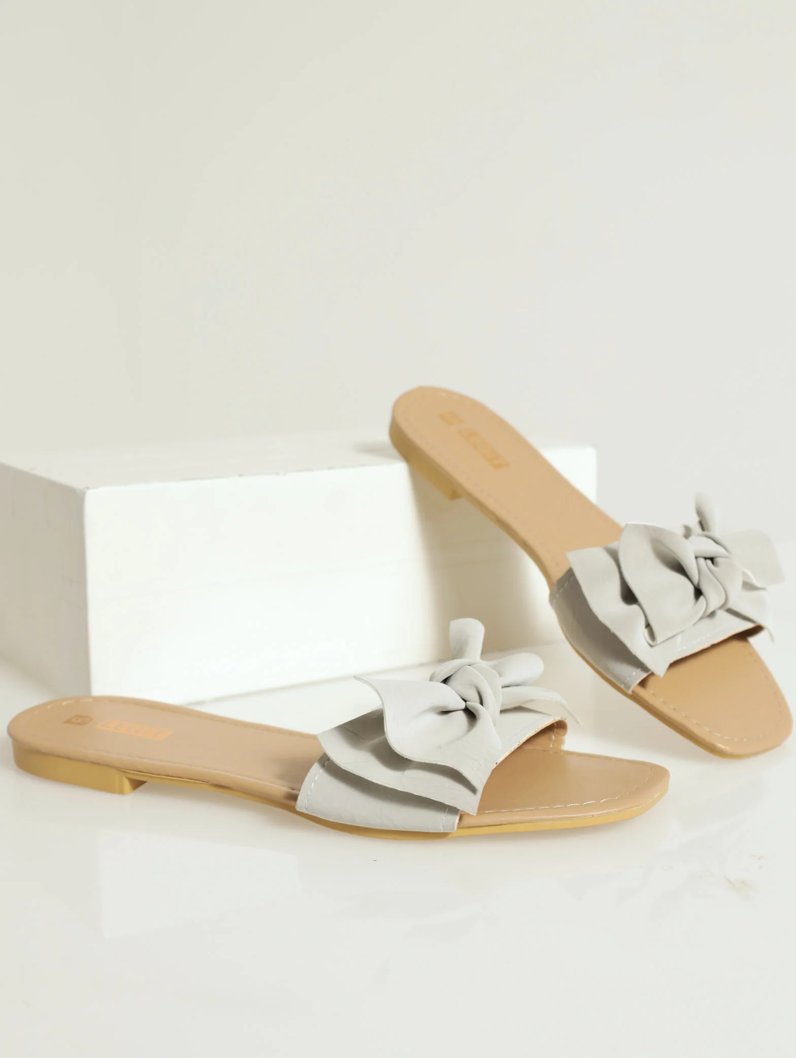 Flat One Strap Bow Detail Push In Mule