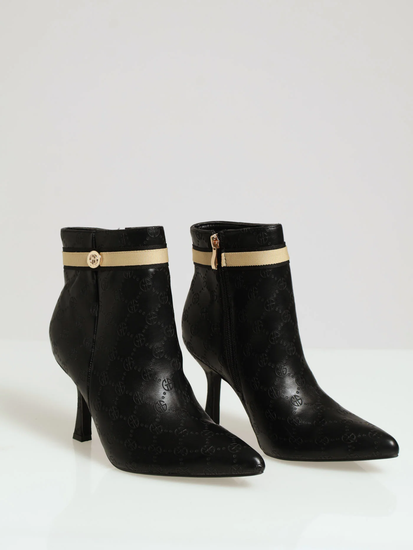 Heeled Ankle Monogram Embossed Boot - Black