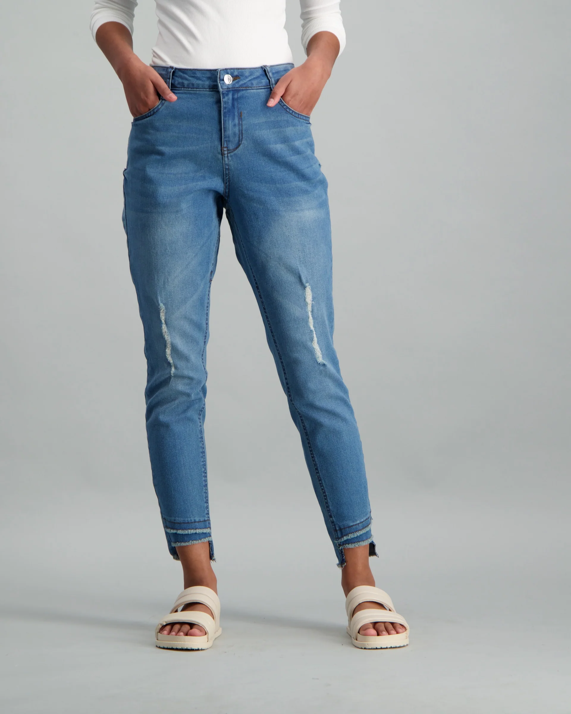 Slanted Fray Hem Push-Up Stonewash Denim Jean